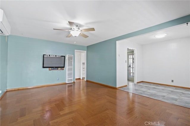 empty room with ceiling fan, parquet flooring, and a wall unit AC