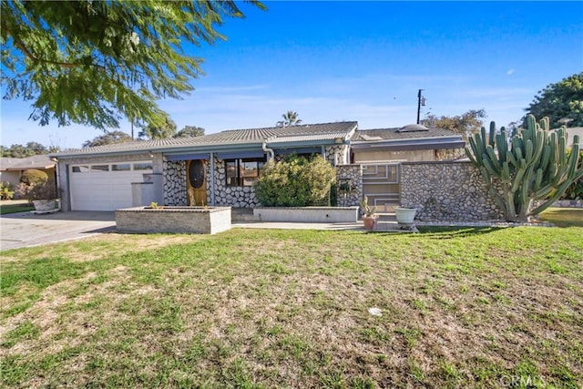 ranch-style house with a front lawn and a garage