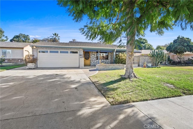 single story home featuring a garage and a front lawn