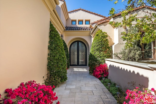 entrance to property featuring french doors