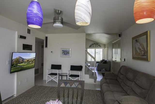 tiled living room with vaulted ceiling