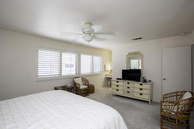 bedroom with ceiling fan and light colored carpet