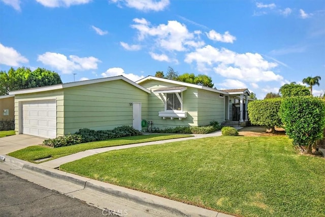 view of front of house with a front lawn and a garage