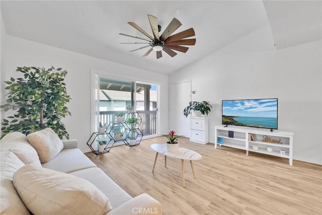 living room with ceiling fan, light hardwood / wood-style floors, and lofted ceiling