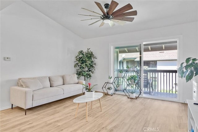 living room with ceiling fan and light hardwood / wood-style flooring