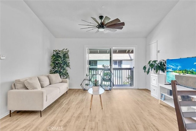 living room featuring light wood-type flooring and ceiling fan