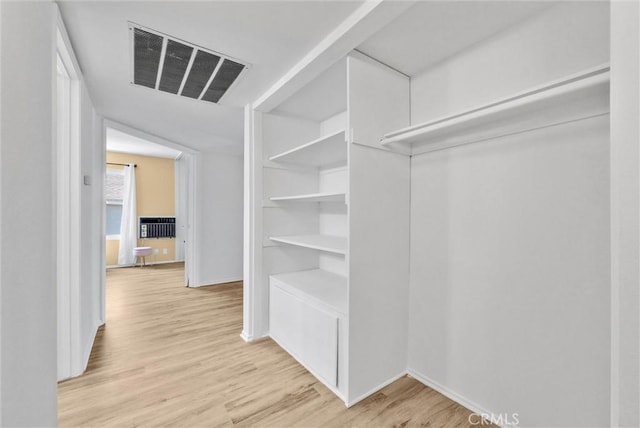 spacious closet featuring light hardwood / wood-style flooring