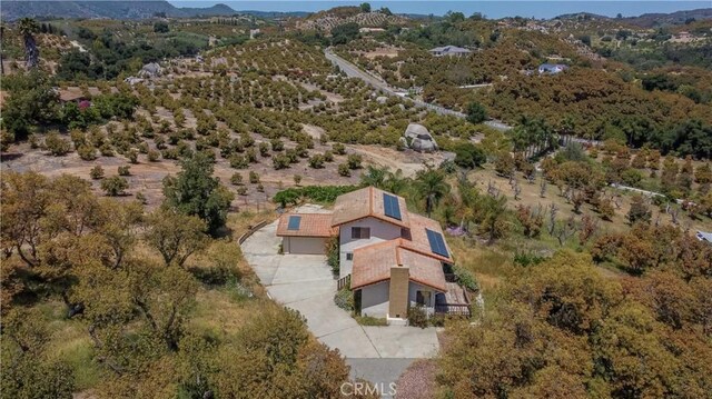 drone / aerial view featuring a mountain view