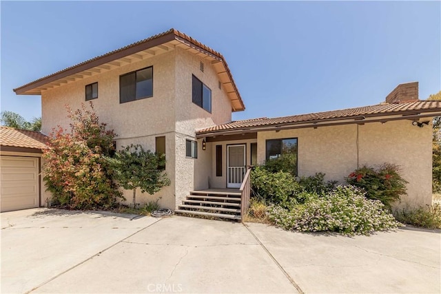 mediterranean / spanish-style home featuring a garage