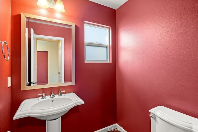 bathroom with toilet and sink