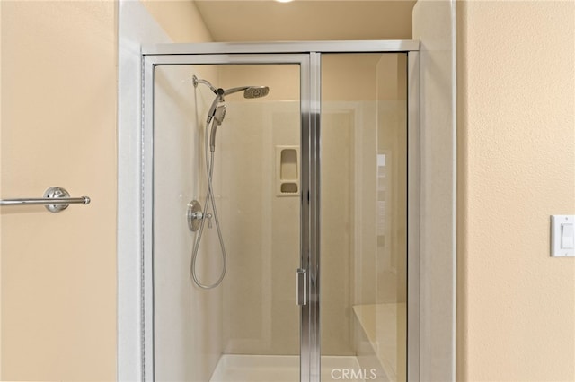 bathroom featuring an enclosed shower