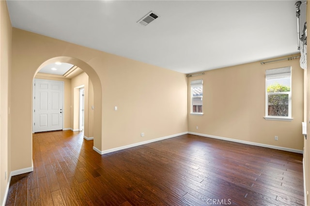 unfurnished room featuring dark hardwood / wood-style floors