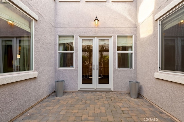 doorway to property featuring french doors and a patio