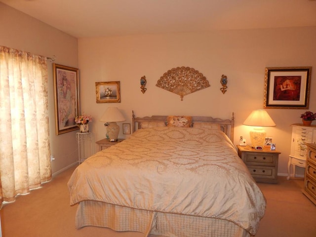 bedroom featuring light carpet