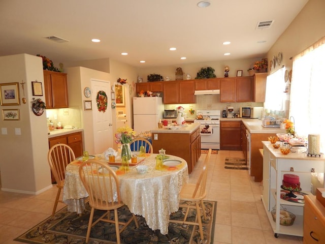 dining area with light tile patterned floors