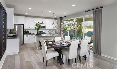 dining space featuring light hardwood / wood-style flooring