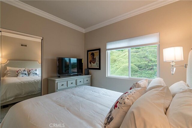 bedroom featuring ornamental molding