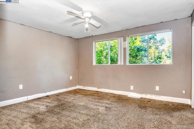 carpeted empty room with ceiling fan