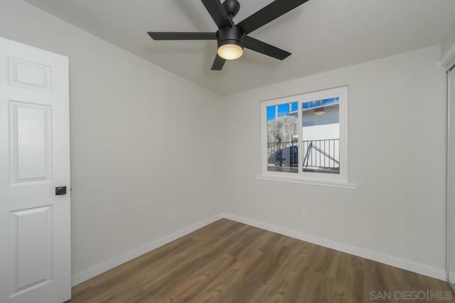 empty room featuring ceiling fan and hardwood / wood-style flooring