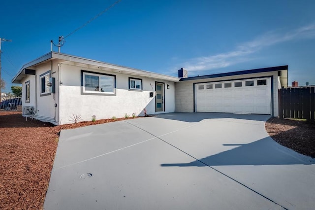 ranch-style home featuring a garage