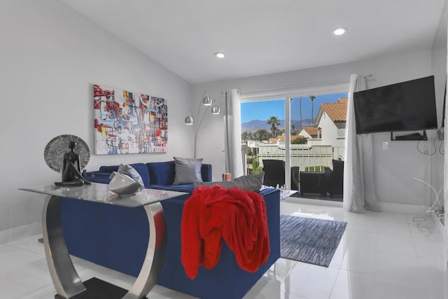 living room with light tile patterned floors and lofted ceiling