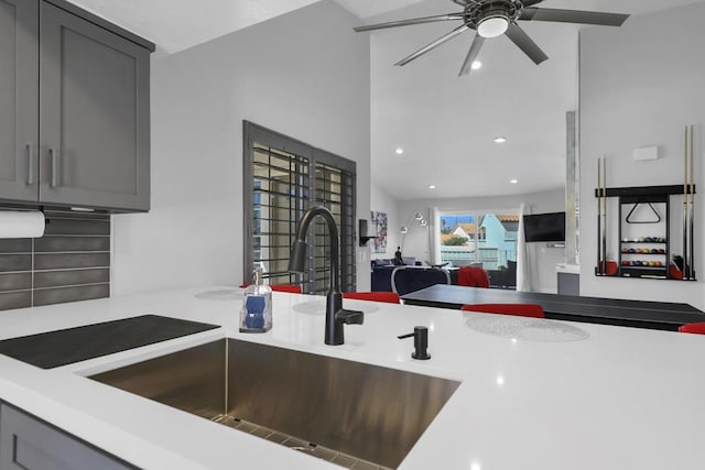 kitchen with ceiling fan, sink, and gray cabinets