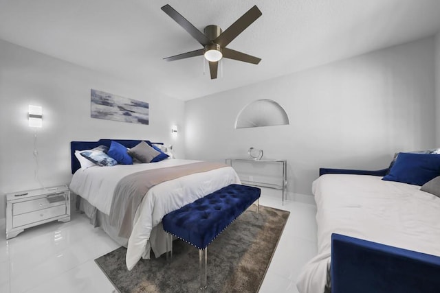 tiled bedroom with ceiling fan