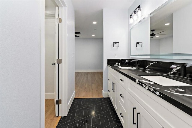 bathroom with ceiling fan and vanity