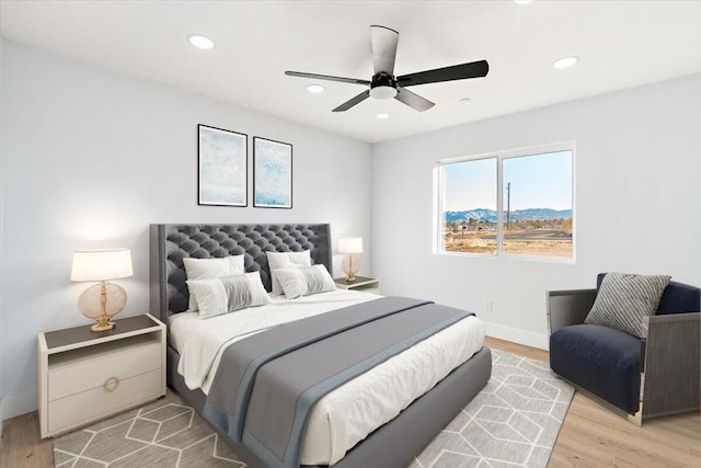 bedroom featuring ceiling fan and light hardwood / wood-style floors