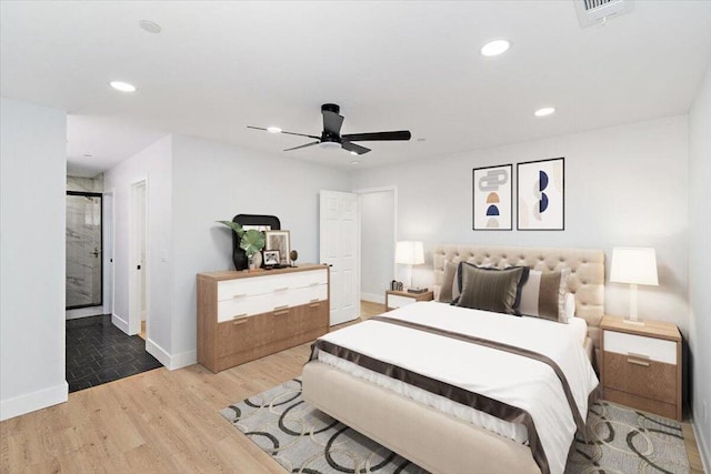 bedroom with ceiling fan and hardwood / wood-style floors