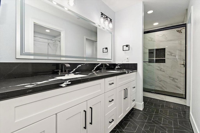 bathroom with tasteful backsplash, vanity, and a shower with door