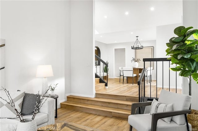 interior space featuring an inviting chandelier and hardwood / wood-style flooring