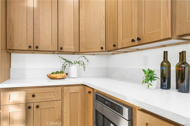 kitchen featuring light stone countertops