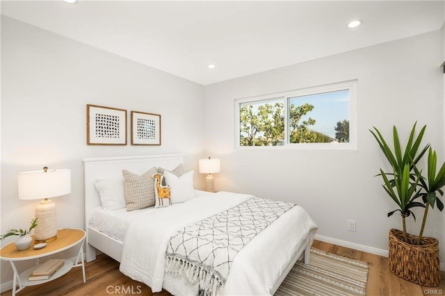 bedroom featuring hardwood / wood-style flooring