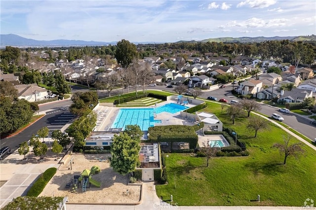 birds eye view of property with a mountain view