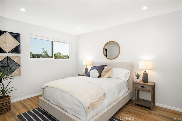 bedroom featuring wood-type flooring