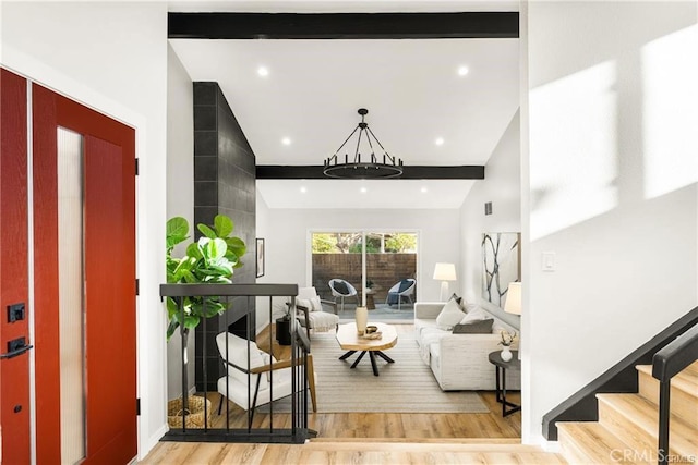 living room featuring high vaulted ceiling, beam ceiling, and light wood-type flooring