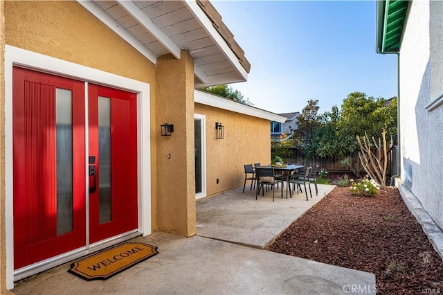 doorway to property with a patio