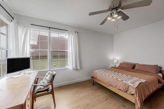 bedroom featuring ceiling fan and light hardwood / wood-style flooring