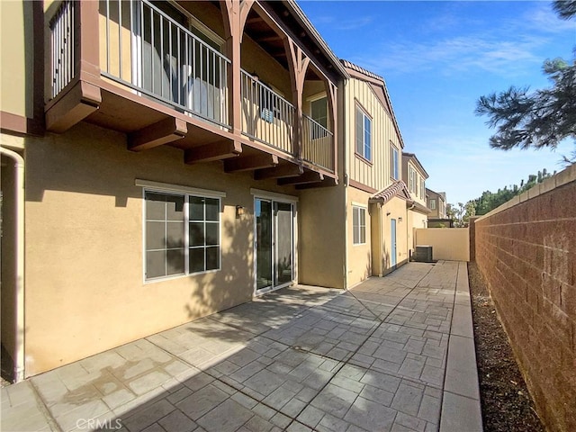 rear view of property featuring a patio area