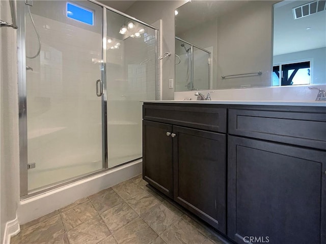 bathroom with vanity and an enclosed shower