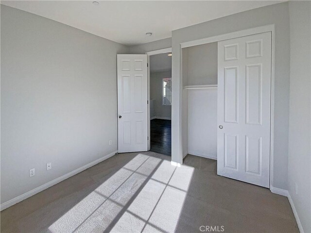 unfurnished bedroom with a closet