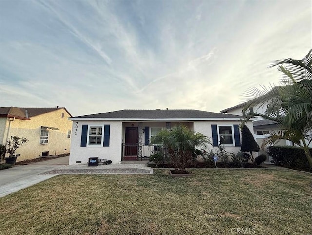 single story home with covered porch and a front yard