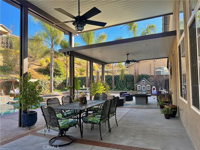 view of patio featuring ceiling fan