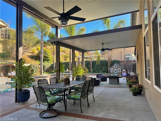 view of patio featuring ceiling fan