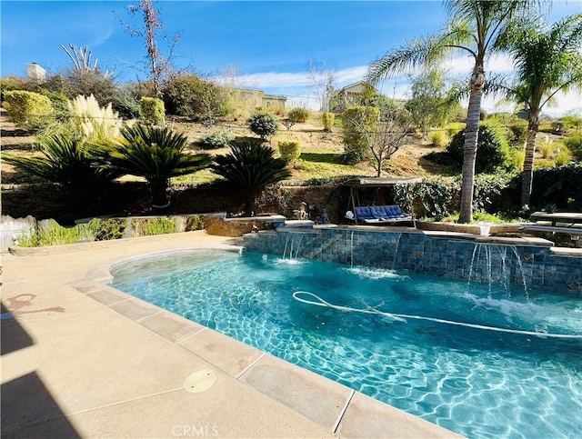 view of swimming pool featuring pool water feature