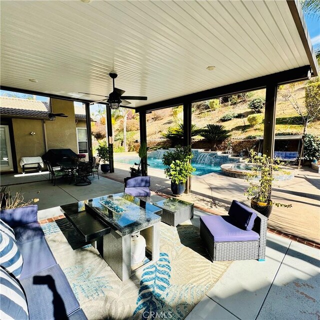 view of patio / terrace with an outdoor living space and ceiling fan