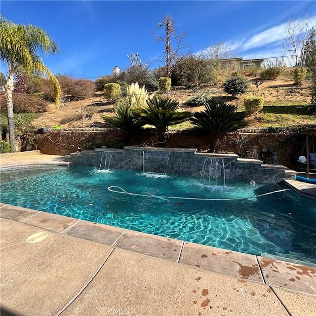 view of pool with pool water feature