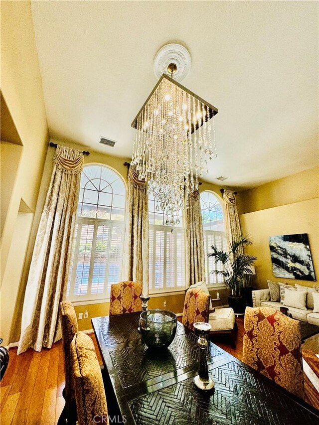 dining area with a chandelier and hardwood / wood-style floors