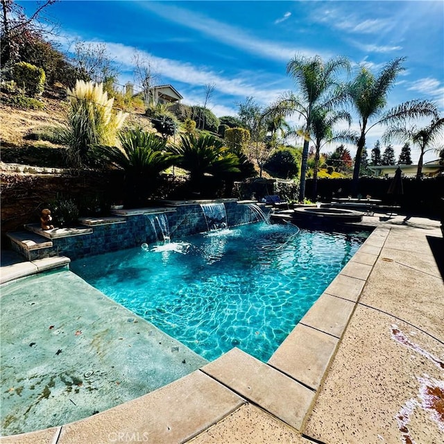 view of swimming pool with a patio area and pool water feature